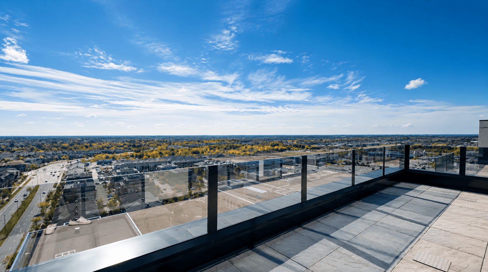 Penthouse living and kitchen with floor-to-ceiling windows